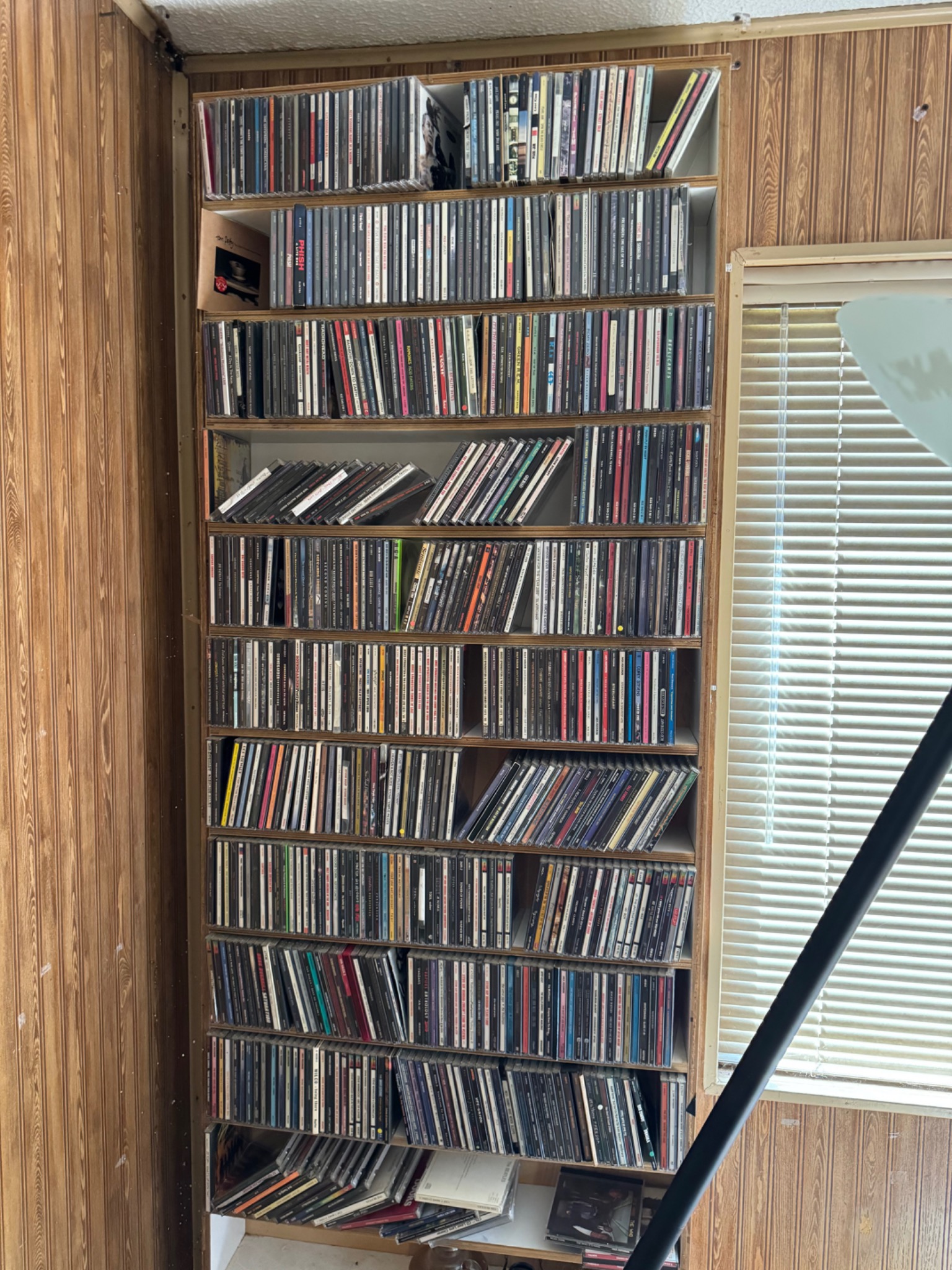 A wall of CDs from WRKN's physical music library